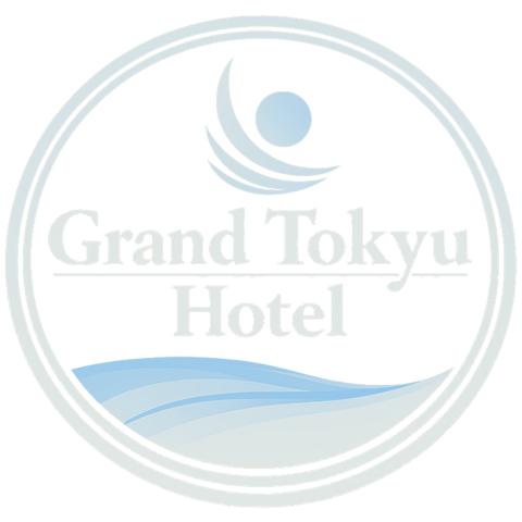 Grand Tokyu Hotel logo — a blue roundel with a sun over a wave, reading Grand Tokyu Hotel